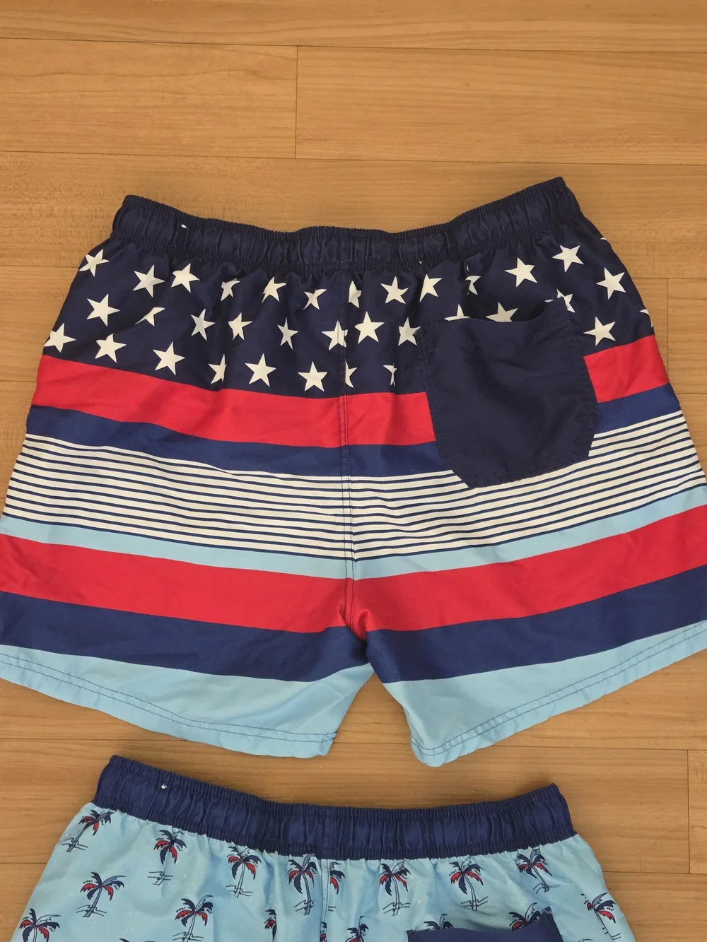 2 Pairs Boys Large Light Blue Palm Print Swim Shorts with Navy & Red Accents